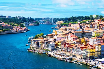 Aerial view of Ribeira area in Porto, Portugal during a sunny day with river - obrazy, fototapety, plakaty
