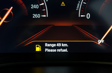 Digital Fuel gauge empty tank car on dashboard. Modern technology of car In the display of the calculation range of the distance to which the car can drive