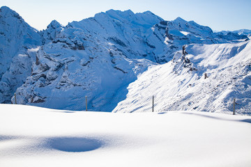 amazing snow covered peaks in the Swiss alps Jungfrau region from Schilthorn