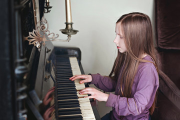 Girl plays piano