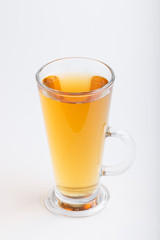 Glass of green grape juice isolated on white background. Side view