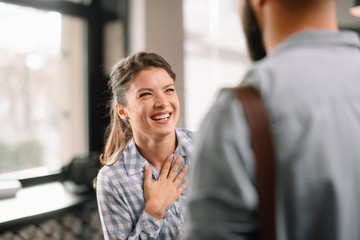 Business people in office talking. Beautiful businesswoman talking with colleagues.