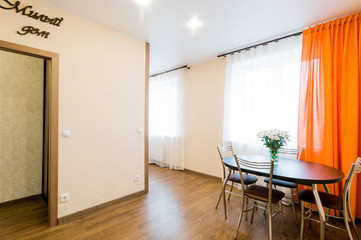 Russia, Moscow- July 08, 2019: interior room apartment. standard repair decoration in hostel. bouquet of daisies on the table