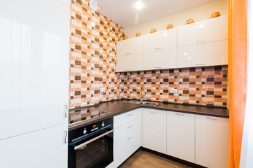 Russia, Moscow- July 08, 2019: interior room apartment. standard repair decoration in hostel. modern kitchen, dining area