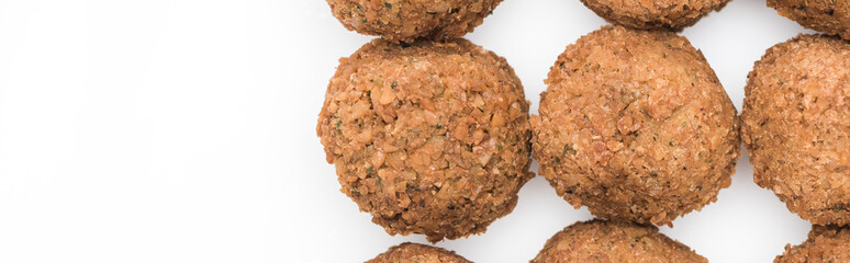 top view of delicious fresh cooked falafel balls on white background with copy space, panoramic shot