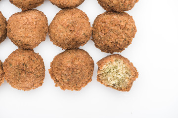 top view of fresh cooked falafel balls on white background with copy space