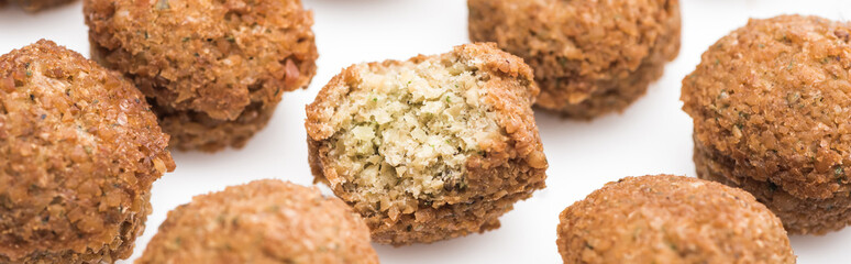 close up view of delicious fresh cooked falafel balls on white background, panoramic shot