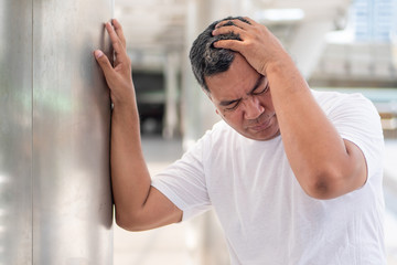 sick asian senior man suffering from vertigo headache; mental sickness concept for vertigo,...
