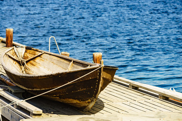 Old boat on pier, norway fjord