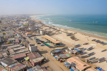 Aerial view of fishing village, pirogues fishing boats in Kayar, Senegal.  Photo made by drone from above. Africa Landscapes.