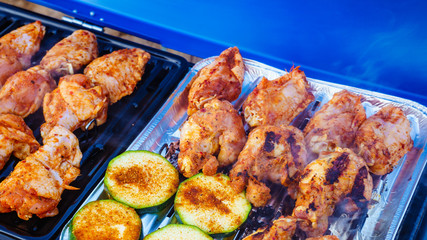 Chicken meat grilling on gas grill