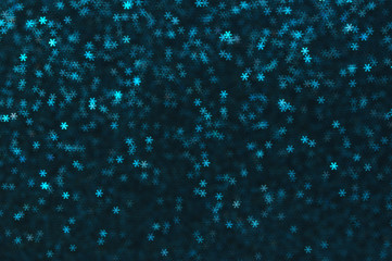 Blue snowflakes bokeh abstract background.