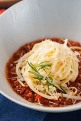 Pasta with Bolognese Sauce and Parmesan. Sective focus