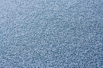 Background of blue frost on the glass