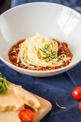 Pasta with Bolognese Sauce and Parmesan. Sective focus