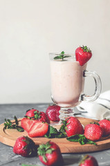 strawberry smoothie with mint on the table, front view - 305420232