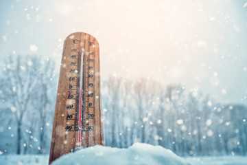 Thermometer on snow shows low temperatures