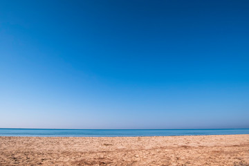 Fototapeta na wymiar Beautiful sea background tropical sand beach and blue sky in sunny day