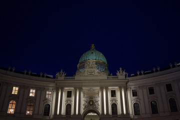 Michaelerkuppel, the dome of the entrance to the Hofburg palace at night, on Michaeler platz. Hofburg is the former Austro Hungarian imperial palace of Vienna, Austria