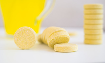 Multivitamin supplement tablet. Soluble Vitamin. Fizzy tablet. Orange flavored effervescent tablets