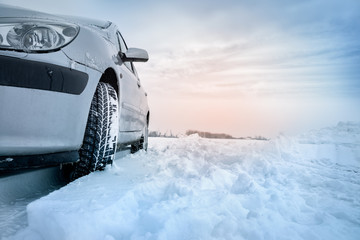 Winter tires in the snow, car safety concept