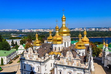 Fototapeta na wymiar View of Dormition Cathedral of the Kyiv Pechersk Lavra (Kiev Monastery of the Caves) and the Dnieper river in Ukraine. View from Great Lavra Bell Tower
