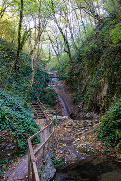 Waterfall in autumn on the tourist route Berendeevo Kingdom. It is a landmark of Lazarevsky district of Sochi, Russia. October 4, 2019