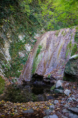 Obraz premium Autumn waterfall in Mamedov gorge in Lazarevsky district of Sochi, Russia. 4 November 2019