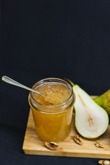 Fresh pear jam on the wooden table