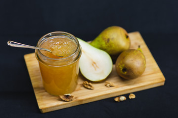Fresh pear jam on the wooden table