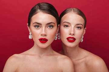 Beautiful young two women with bright red lipstick