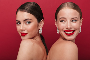 Cheery positive two women with bright red lipstick