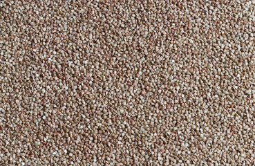 dry buckwheat background, buckwheat texture, top view
