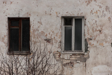 Fototapeta na wymiar An old wooden window on a very old building