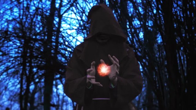 Dark Wizard Using Mysterious Devastating Power In Shelter Of Horror Forest At Halloween