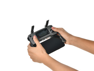 Woman hold remote controller of new small portable drone quadcopter with mobile cellphone attached...