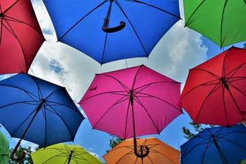 colorful umbrellas on a background of blue sky