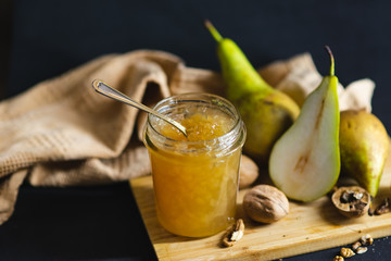 Fresh pear jam on the dark table