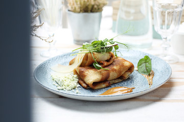 Pancakes with filling, fried appetizing pancakes stuffed with stuffing.