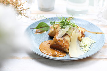 Pancakes with filling, fried appetizing pancakes stuffed with stuffing.