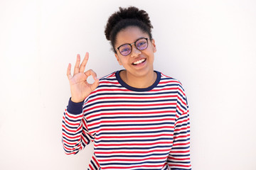 cute african american girl with glasses and ok hand sign