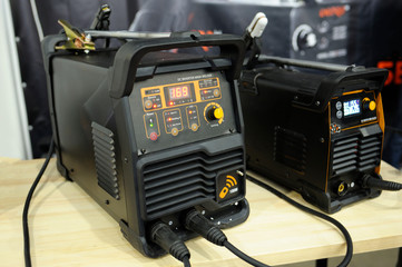 At the workshop. DC inverter MMA welders, household electric welding machine, placed on a table