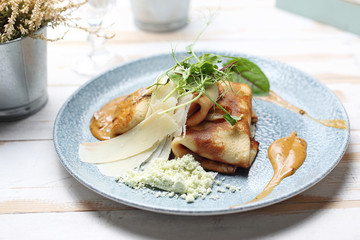 Pancakes with filling, fried appetizing pancakes stuffed with stuffing.