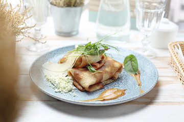 Pancakes with filling, fried appetizing pancakes stuffed with stuffing.