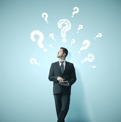 Question mark sketch headed businessman