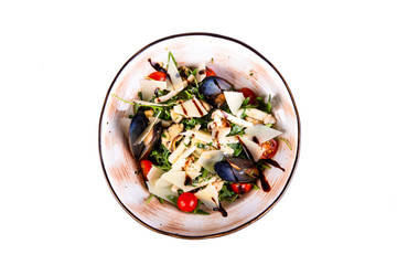 Light salad with parmesan cheese, vegetables and mussels