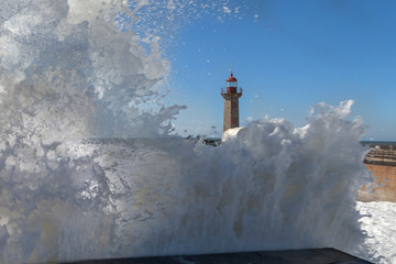 Splashing Atlantic ocean waves in estuary of Douru river, Porto, Portugal.