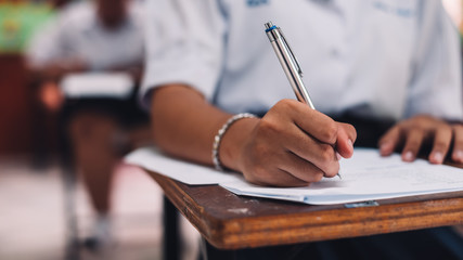 Student taking exam with stress in school classroom.16:9 style