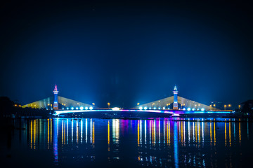 view of night scenery of city in Thailand  with beautiful reflections of skyscrapers and bridges by...