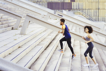 interracial couple training running up stairs